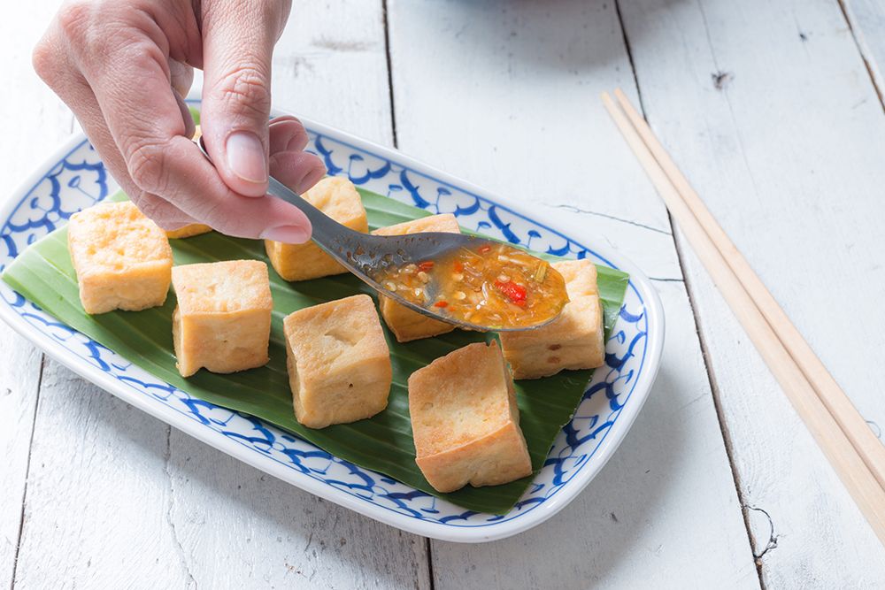 Snack and Dessert, Chinese Traditional Deep Fried Tofu or Fried Bean Curd Served with Sweet and Sour Spicy Sauce.